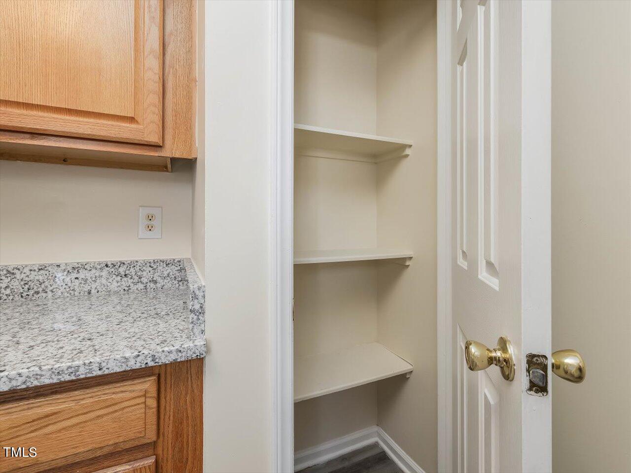 2907 Dearborn Drive Durham, NC 27704 - Photo 21 of 52 a bathroom with a granite countertop sink and a mirror