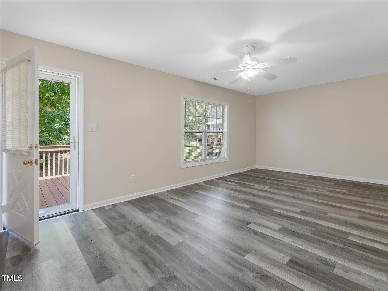 2907 Dearborn Drive Durham, NC 27704 - Photo 23 of 52 a view of an empty room with wooden floor and a window