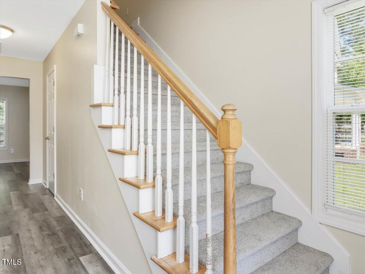 2907 Dearborn Drive Durham, NC 27704 - Photo 30 of 52 a view of staircase with railing and white walls