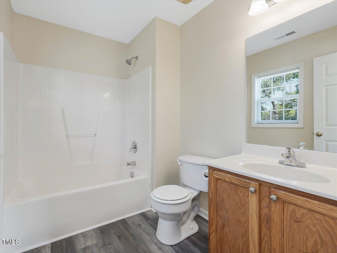 2907 Dearborn Drive Durham, NC 27704 - Photo 35 of 52 a bathroom with a sink a toilet and a bathtub