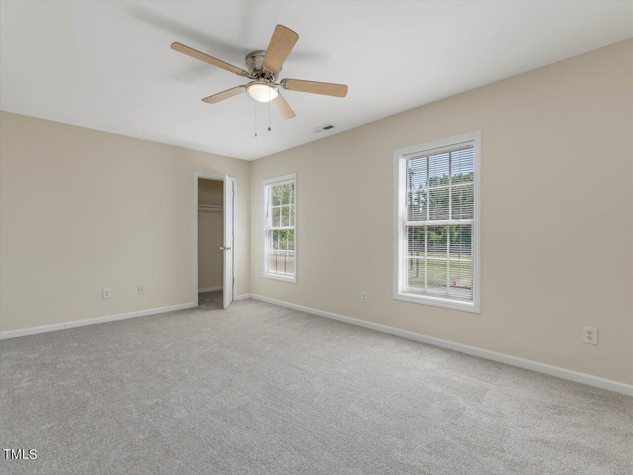 2907 Dearborn Drive Durham, NC 27704 - Photo 36 of 52 an empty room with window and ceiling fan