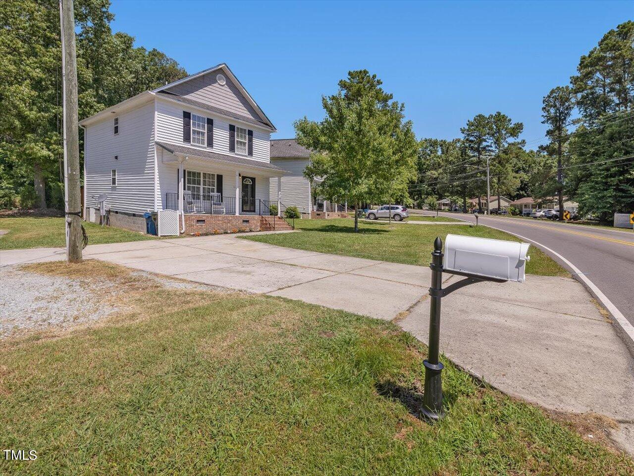 2907 Dearborn Drive Durham, NC 27704 - Photo 49 of 52 a front view of a house with a yard
