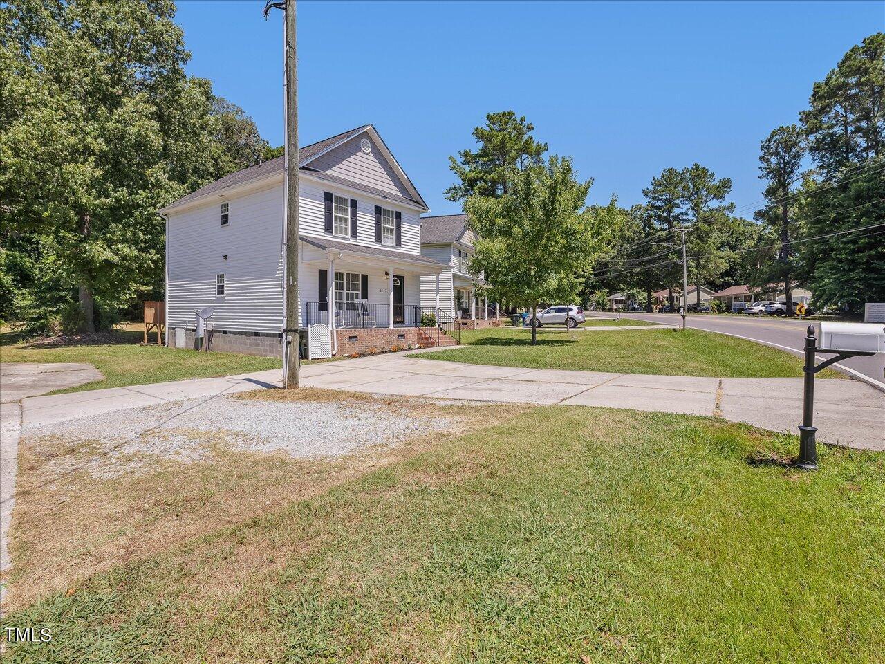 2907 Dearborn Drive Durham, NC 27704 - Photo 50 of 52 a view of a house with a big yard and palm trees