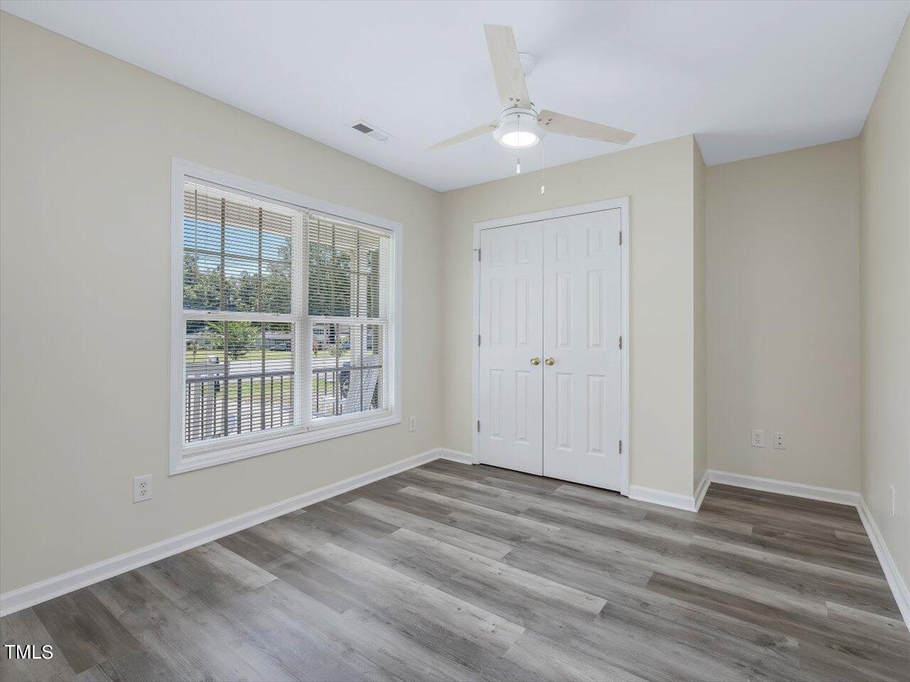 2907 Dearborn Drive Durham, NC 27704 - Photo 9 of 52 a view of empty room with wooden floor and fan