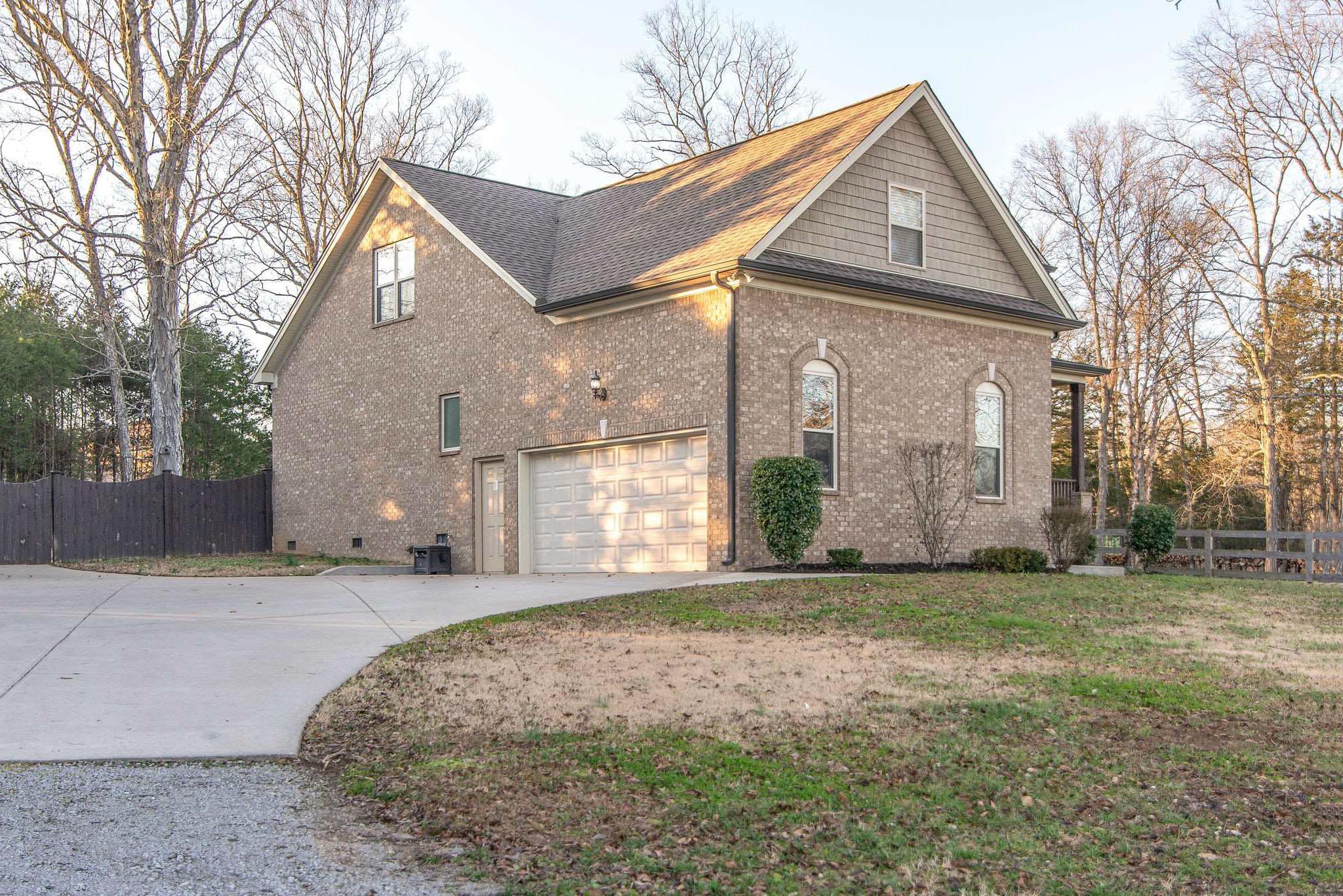 737 Harkreader Road Mount Juliet, TN 37122 - Photo 2 of 26 a view of a house with a yard and garage