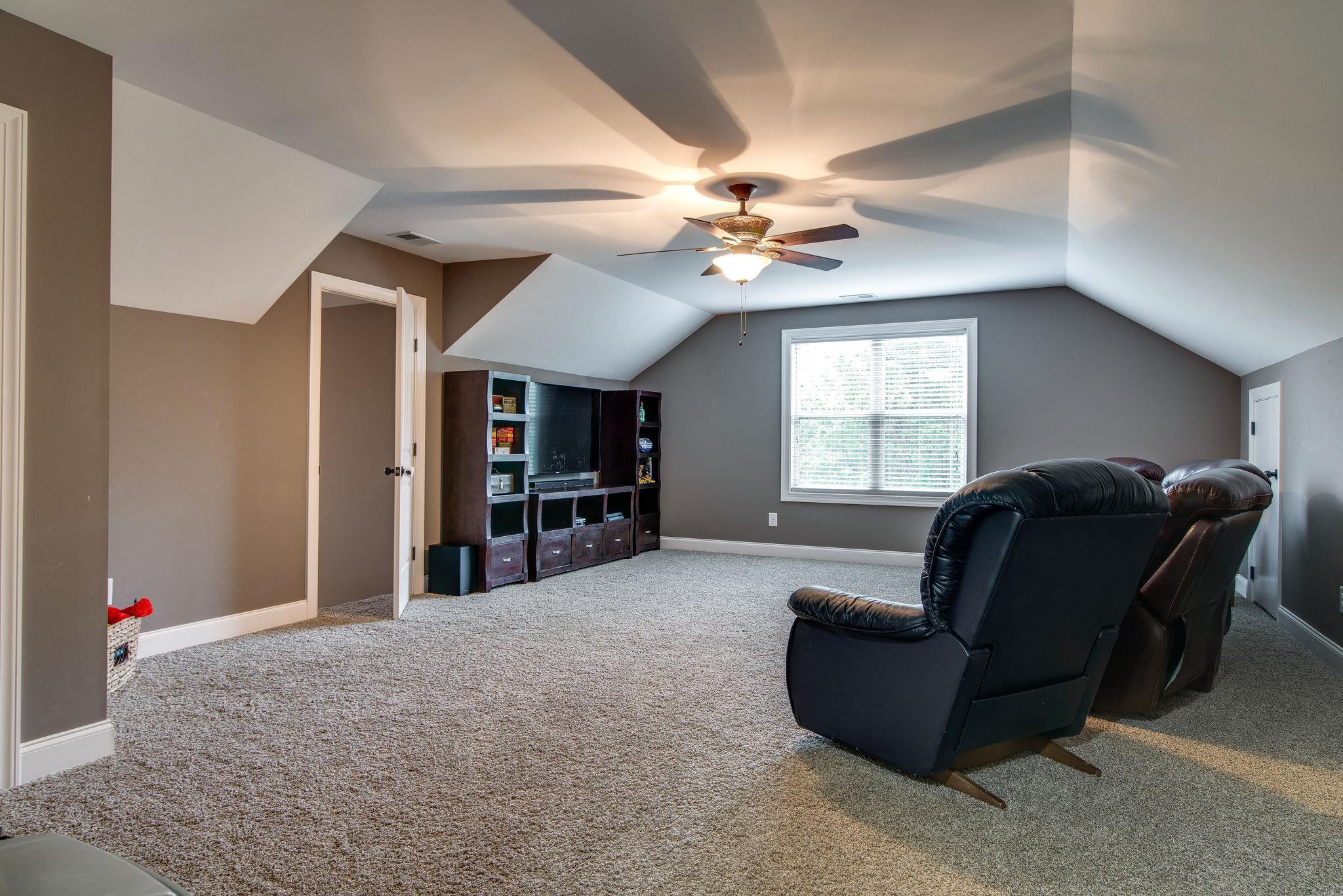 737 Harkreader Road Mount Juliet, TN 37122 - Photo 14 of 26 a living room with furniture and a flat screen tv