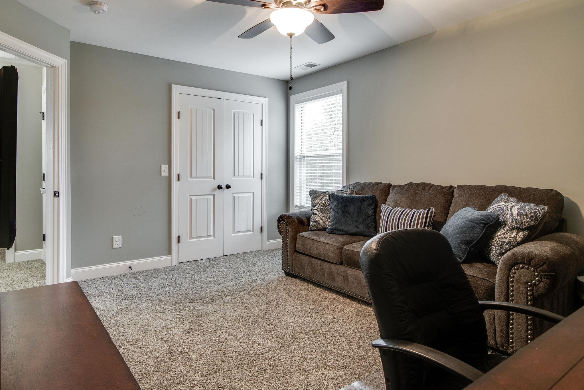 737 Harkreader Road Mount Juliet, TN 37122 - Photo 17 of 26 a living room with furniture and a ceiling fan