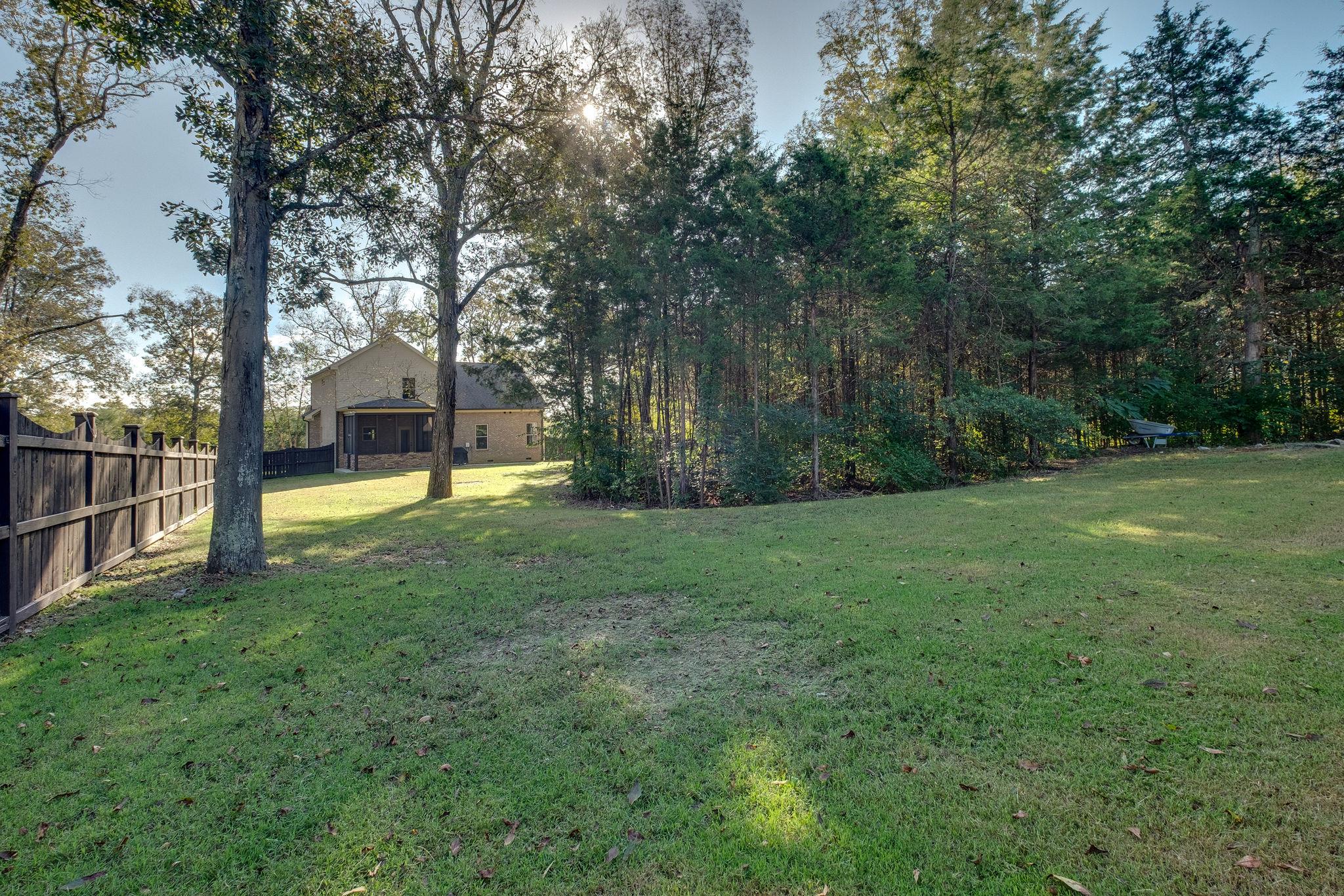 737 Harkreader Road Mount Juliet, TN 37122 - Photo 23 of 26 a view of a backyard with large trees