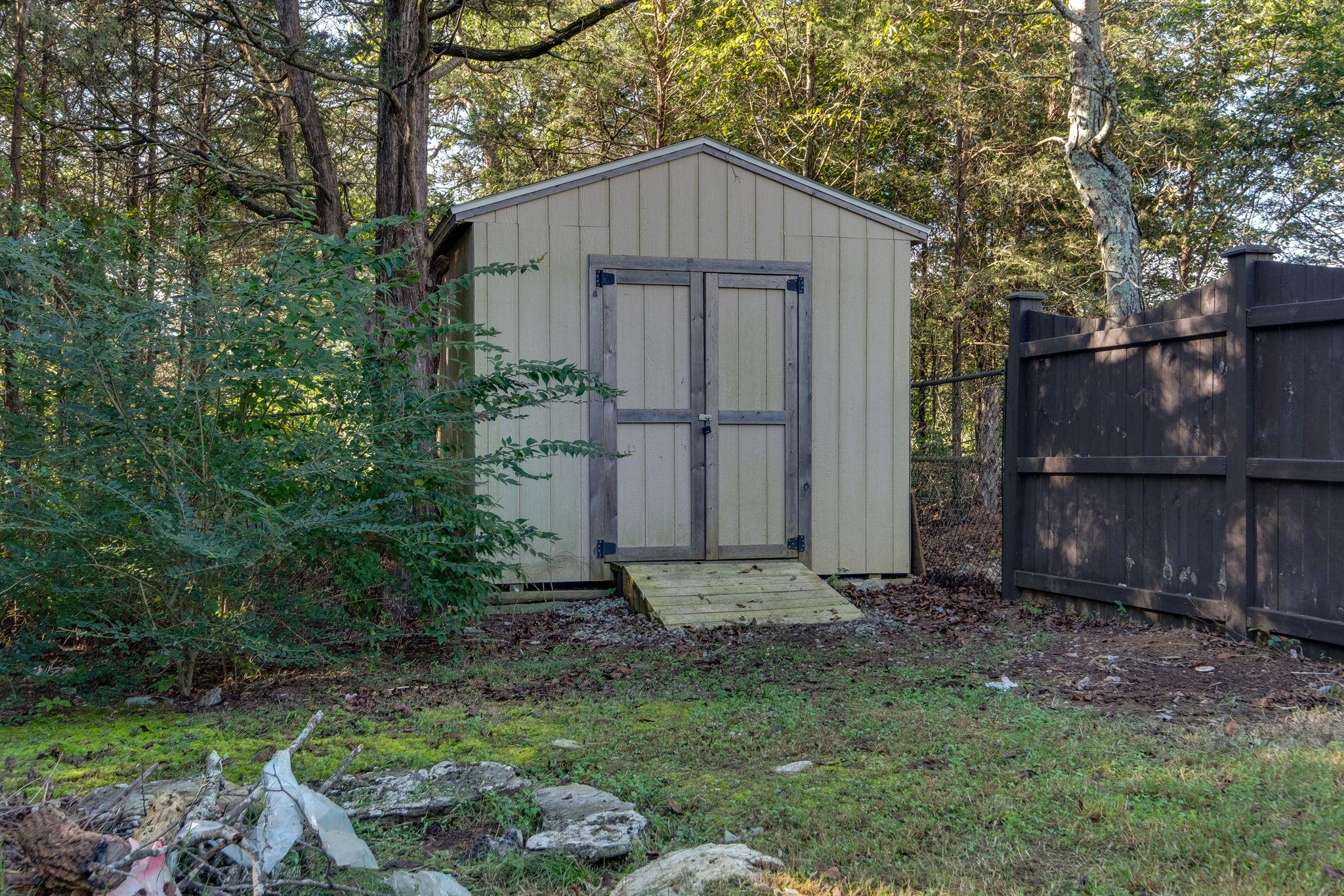 737 Harkreader Road Mount Juliet, TN 37122 - Photo 24 of 26 a backyard of a house with lots of green space