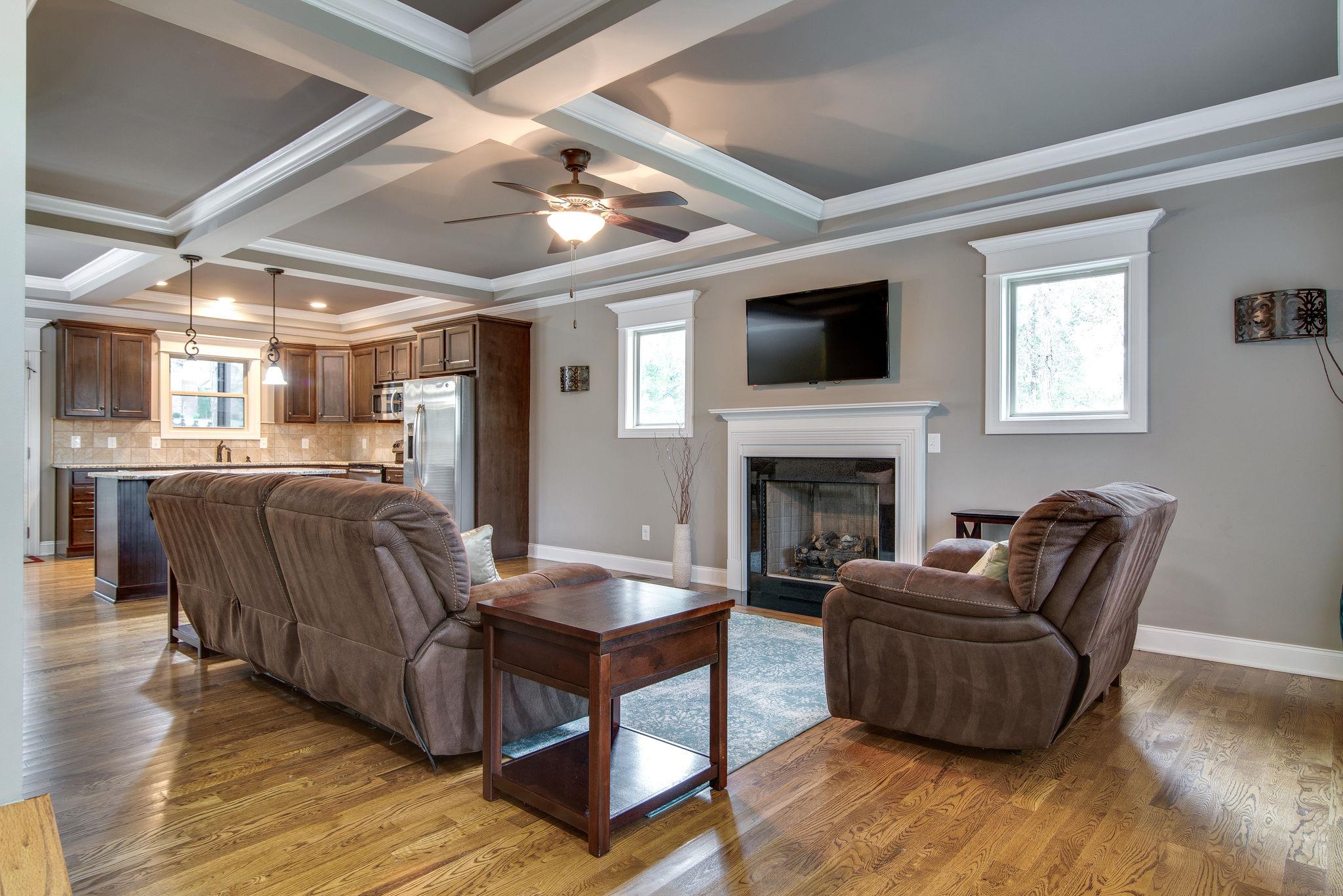 737 Harkreader Road Mount Juliet, TN 37122 - Photo 3 of 26 a living room with furniture and a fireplace