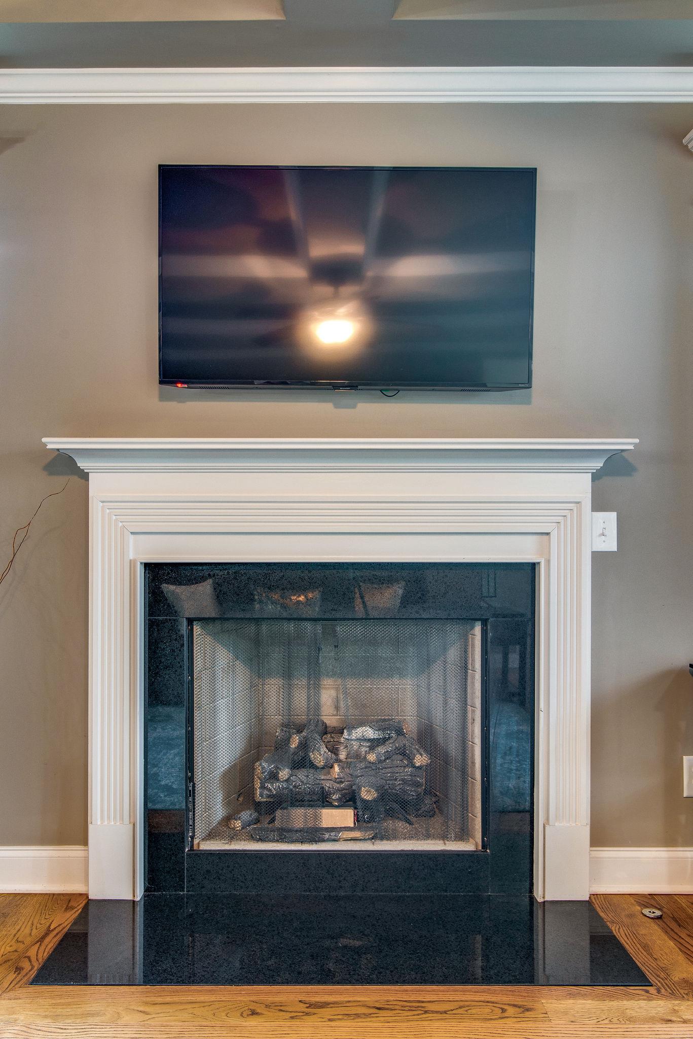 737 Harkreader Road Mount Juliet, TN 37122 - Photo 4 of 26 a fireplace with a hallway