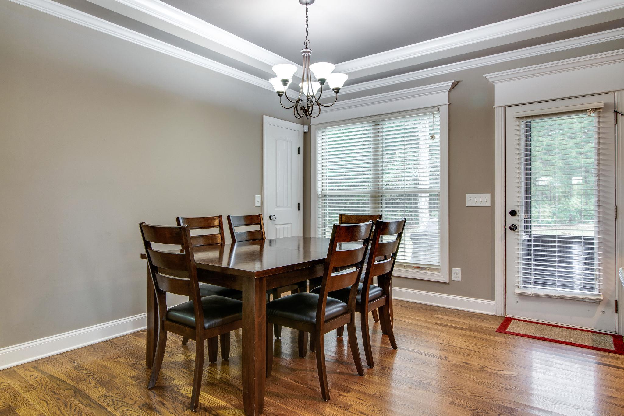 737 Harkreader Road Mount Juliet, TN 37122 - Photo 9 of 26 a view of a dining room with furniture and wooden floor