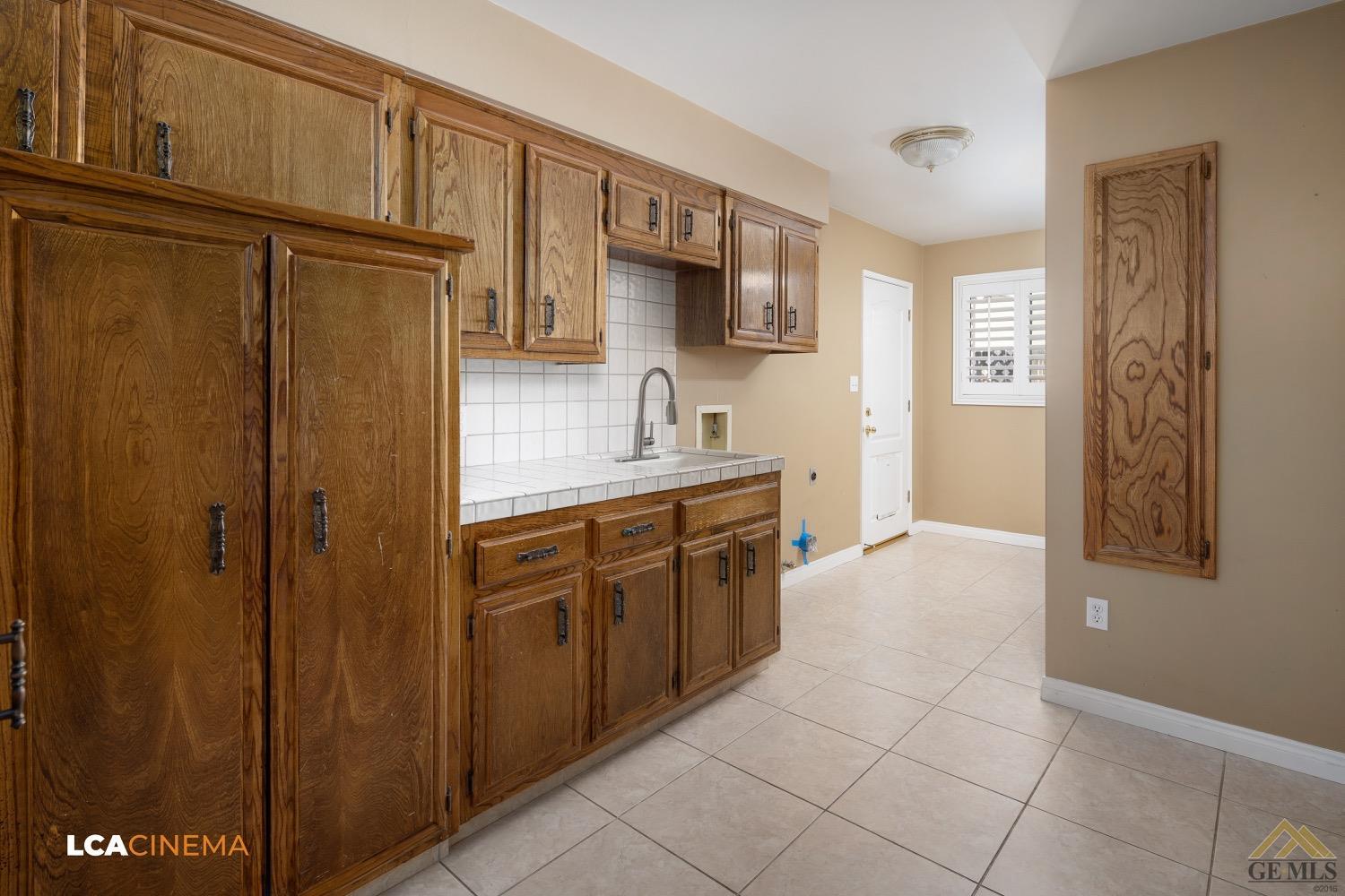 Undisclosed Address Bakersfield, CA 93308 - Photo 11 of 23 a kitchen with stainless steel appliances granite countertop a refrigerator and a sink