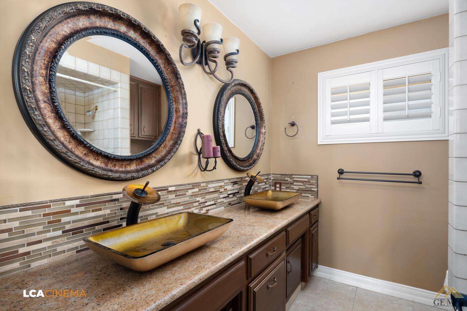 Undisclosed Address Bakersfield, CA 93308 - Photo 14 of 23 a bathroom with a sink and a mirror