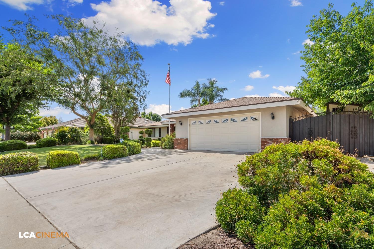 Undisclosed Address Bakersfield, CA 93308 - Photo 3 of 23 a view of a house with a yard and potted plants