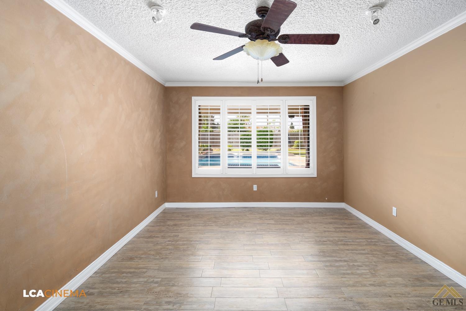 Undisclosed Address Bakersfield, CA 93308 - Photo 6 of 23 a view of an empty room with wooden floor and a window
