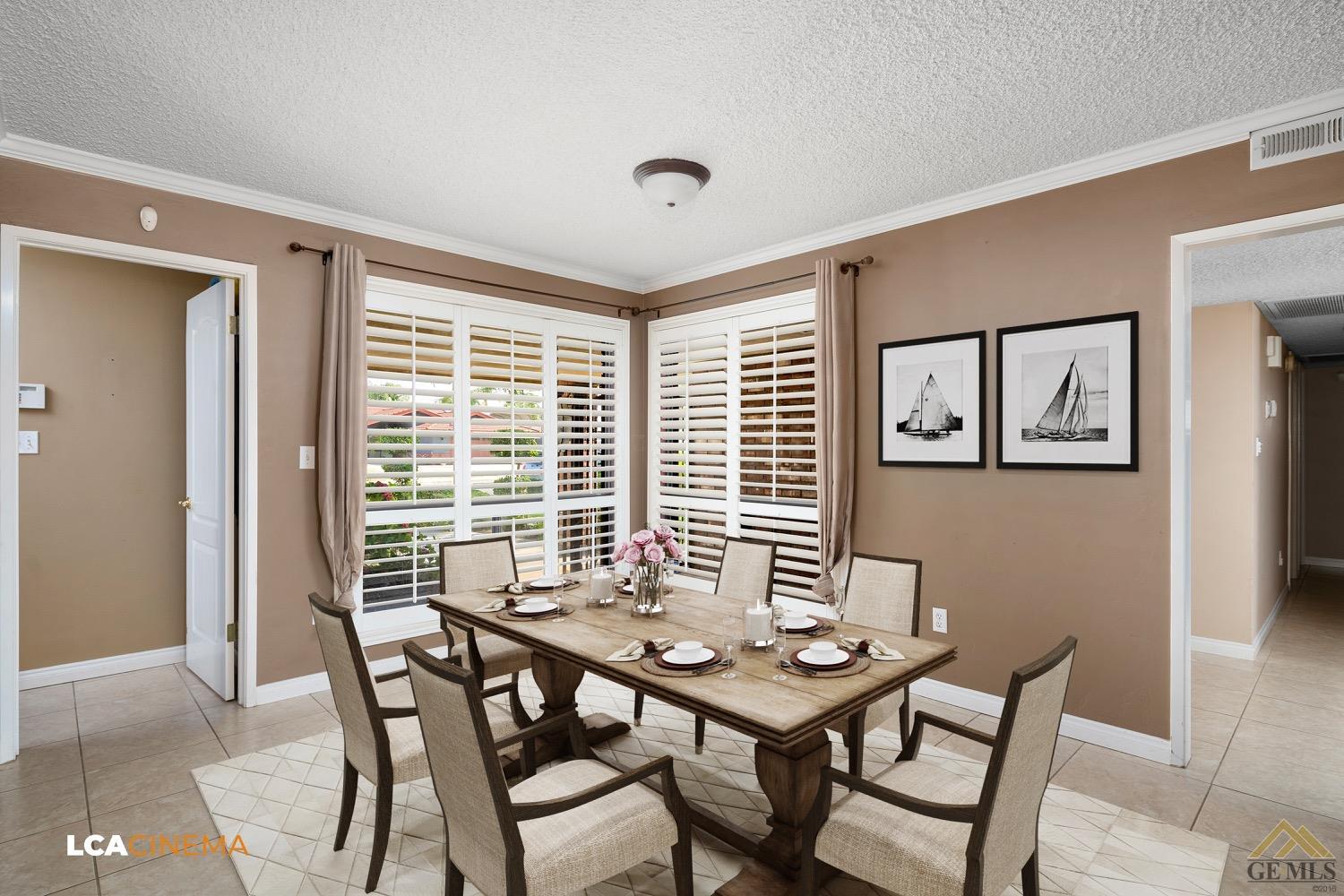 Undisclosed Address Bakersfield, CA 93308 - Photo 7 of 23 a view of a dining room with furniture and wooden floor