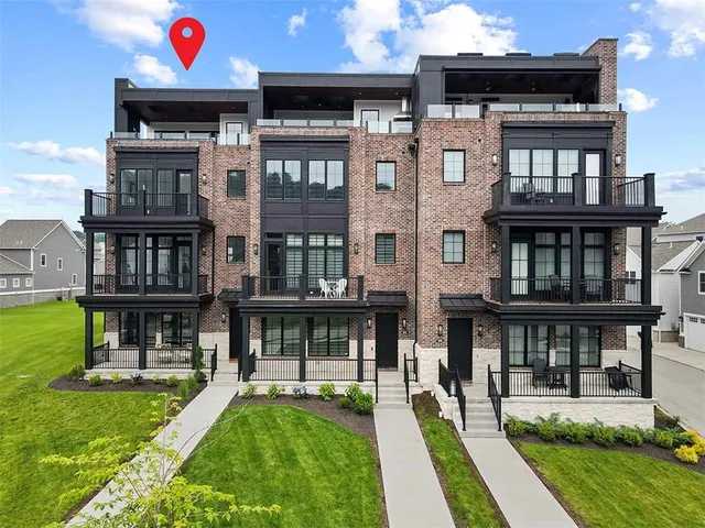 a view of building with a swimming pool