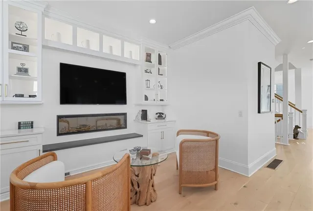 a kitchen with sink a stove and cabinets