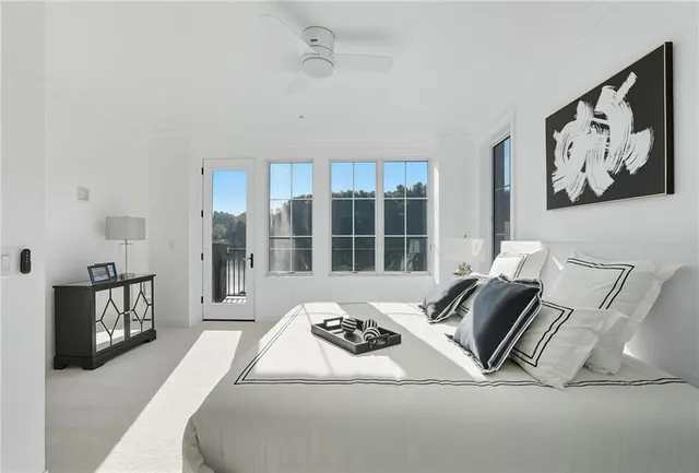 a view of a balcony with wooden floor and lake view