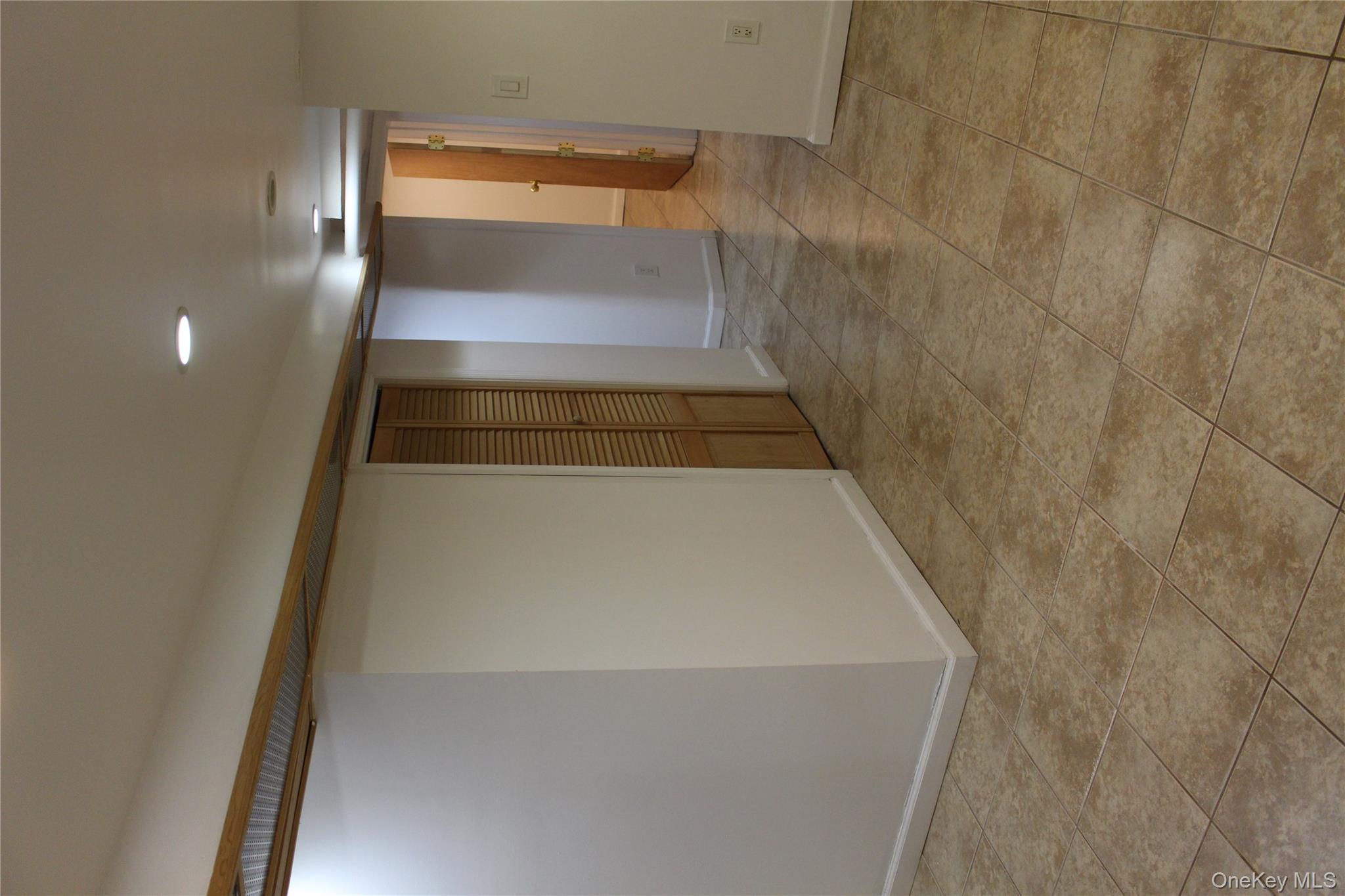 2973 Harding Avenue Bronx, NY 10465 - Photo 16 of 27 Spare room featuring recessed lighting and light tile patterned flooring