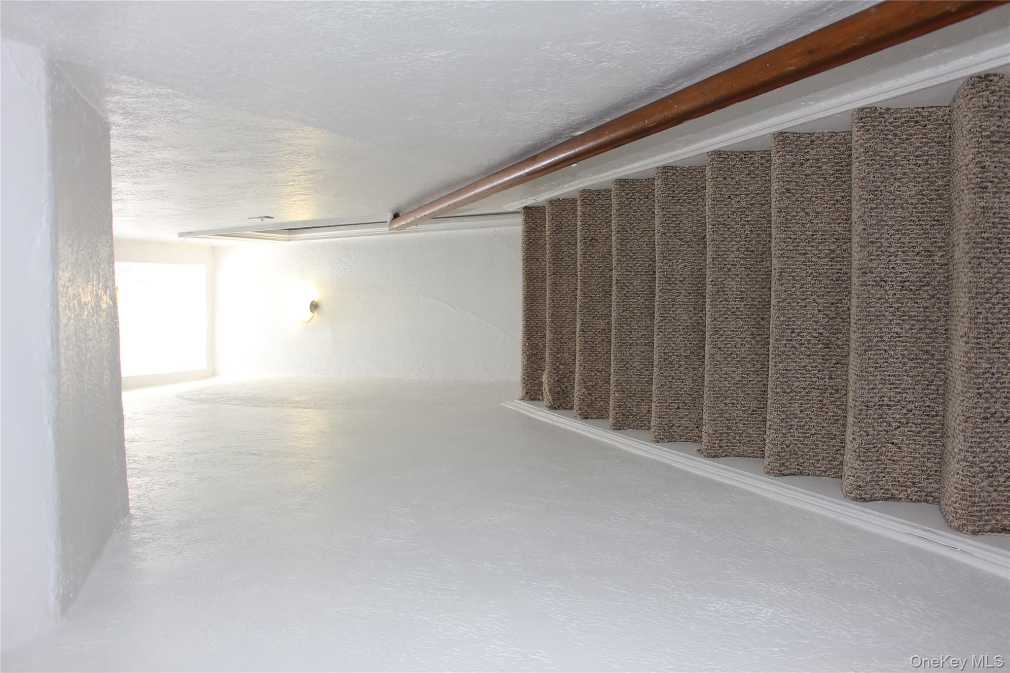 2973 Harding Avenue Bronx, NY 10465 - Photo 17 of 27 Staircase featuring a textured wall