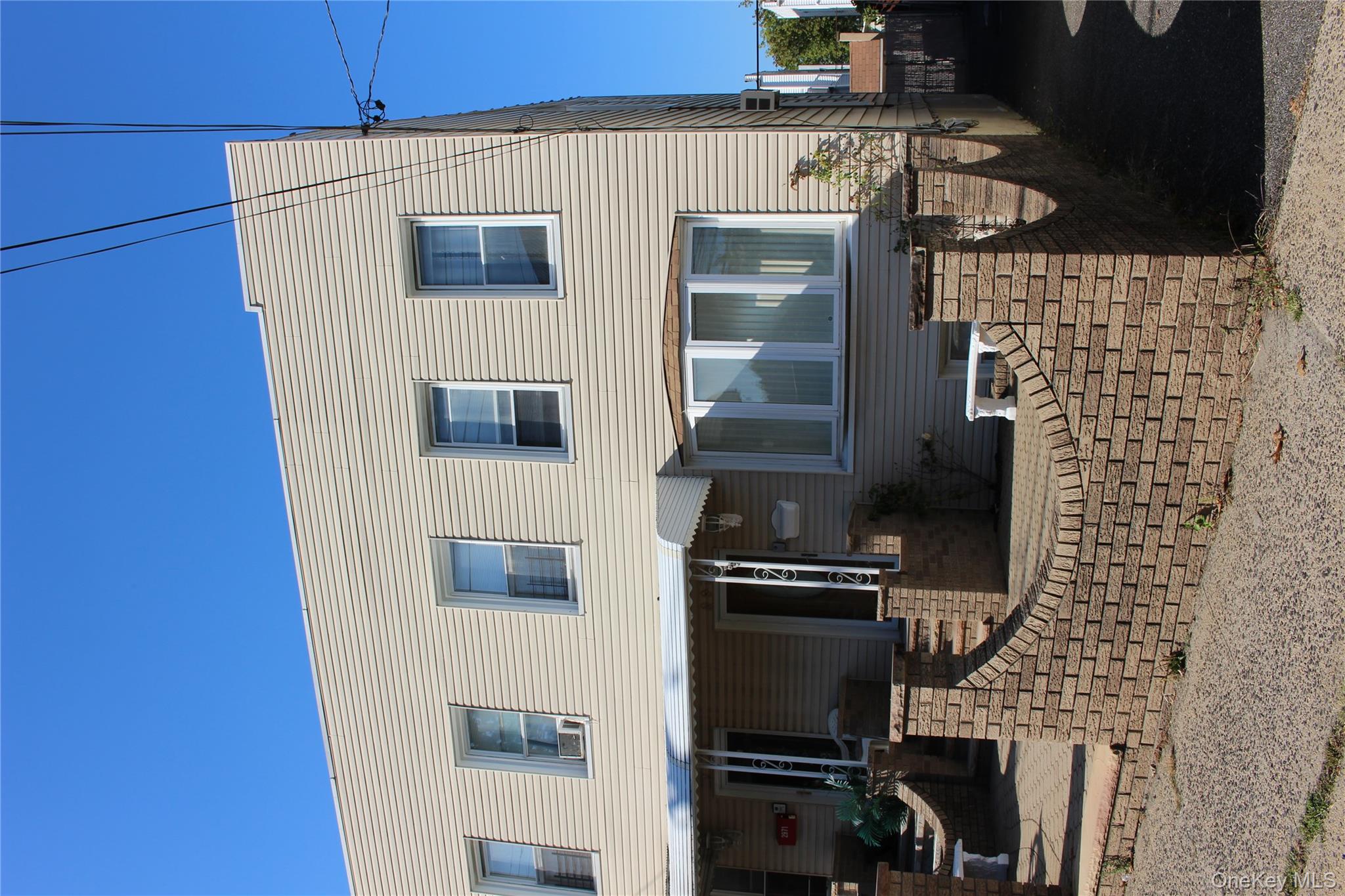 2973 Harding Avenue Bronx, NY 10465 - Photo 2 of 27 View of front facade with covered porch