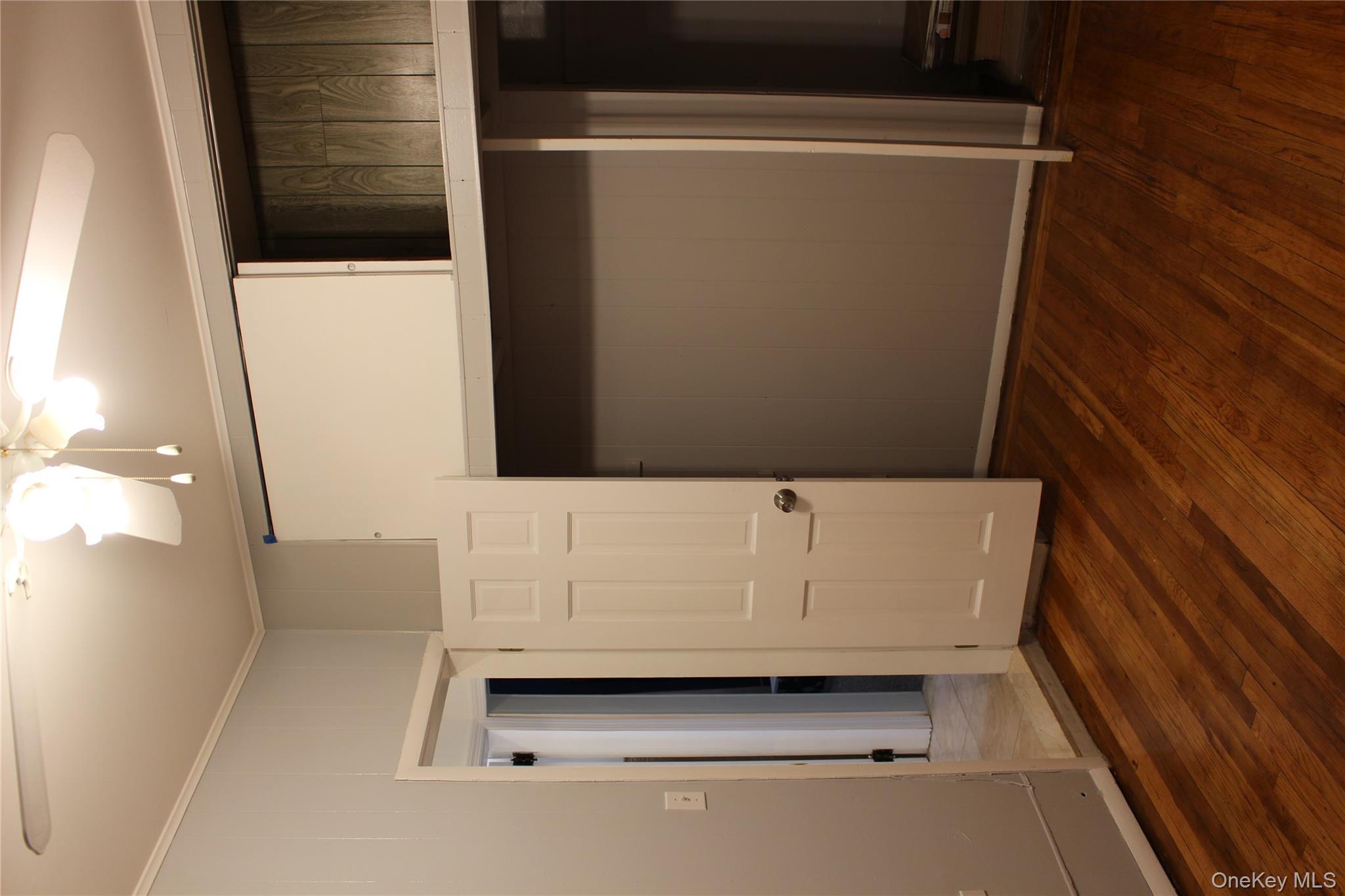 2973 Harding Avenue Bronx, NY 10465 - Photo 24 of 27 Unfurnished bedroom with crown molding, dark wood-type flooring, and ceiling fan