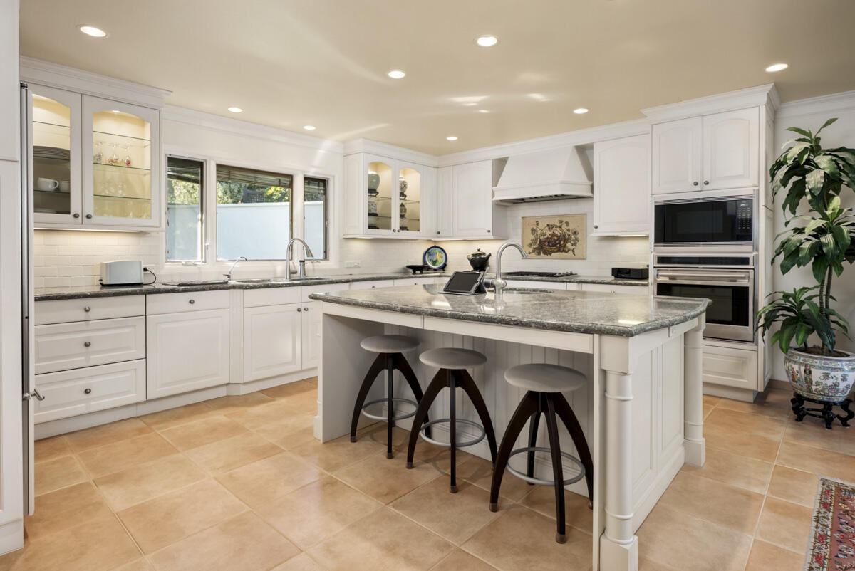 1859 Barker Pass Road Santa Barbara, CA 93108 - Photo 8 of 26 a kitchen with stainless steel appliances granite countertop a stove a sink a refrigerator and a microwave