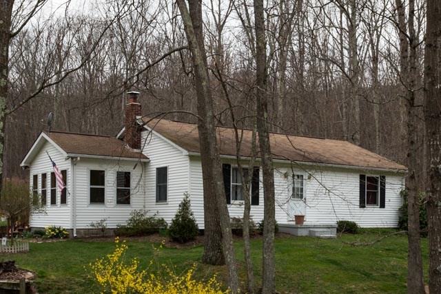 front view of a house with a yard