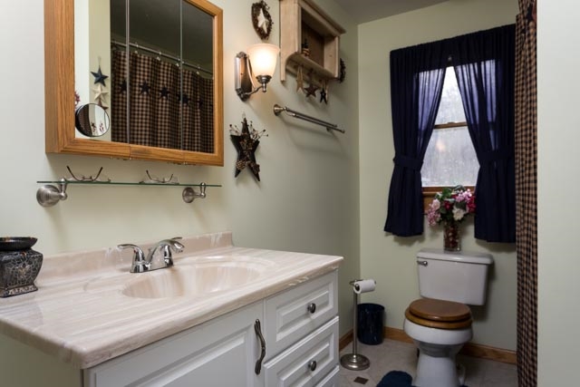 2146 Strawderman Road Mathias, WV 26812 - Photo 8 of 20 a bathroom with a sink toilet and window