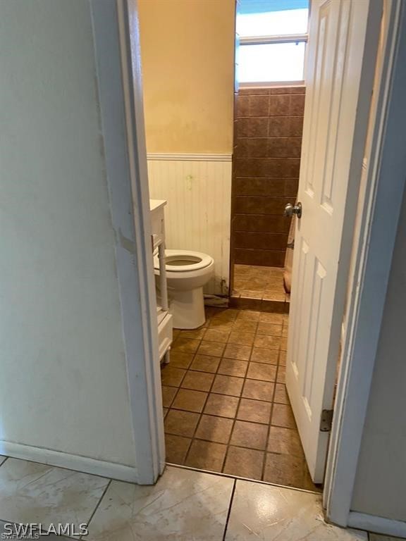 106 Jasmine Road West Lehigh Acres, FL 33936 - Photo 7 of 7 a bathroom with a sink a toilet and a shower