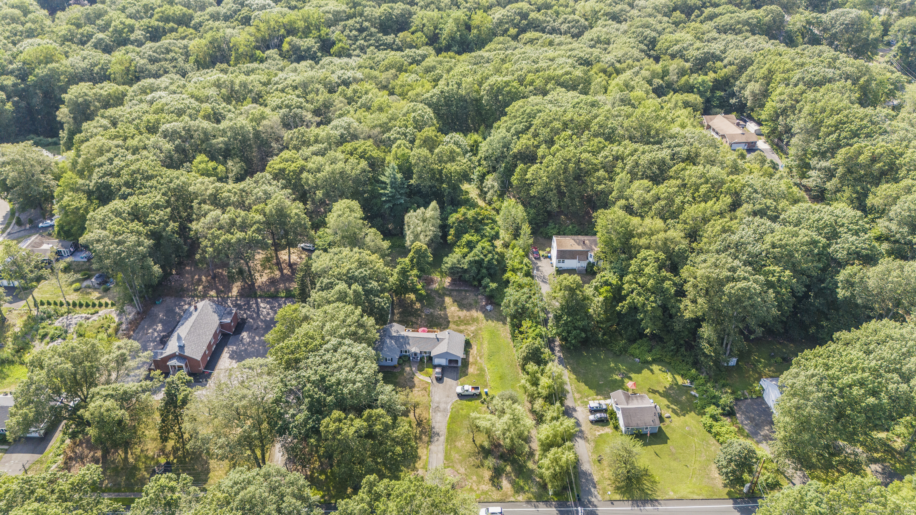 1378 Shepard Avenue Hamden, CT 06518 - Photo 11 of 15 an aerial view of residential house with outdoor space and trees all around