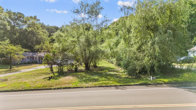 a backyard of a house with lots of green space