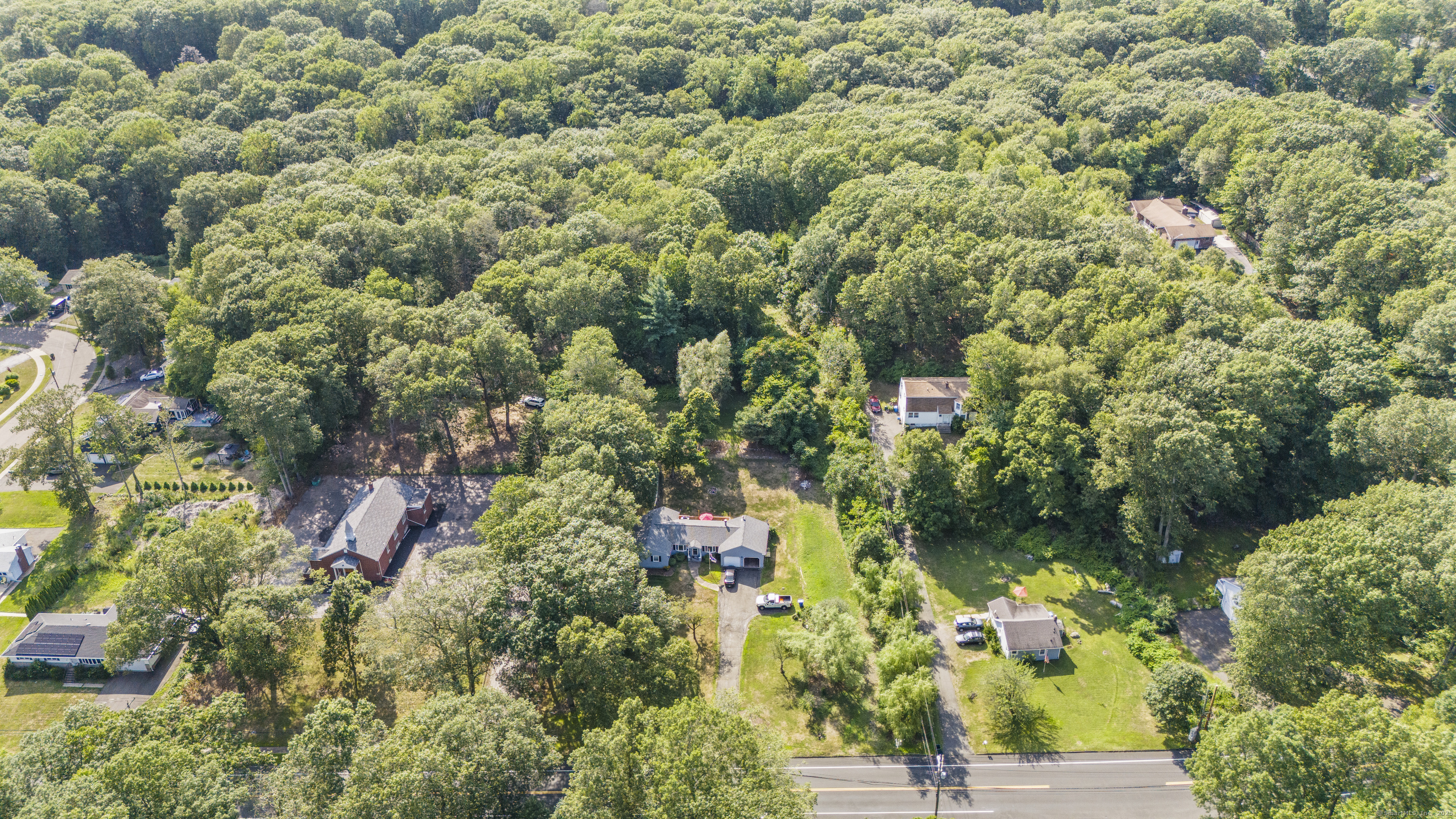 1378 Shepard Avenue Hamden, CT 06518 - Photo 9 of 15 an aerial view of residential houses with outdoor space and trees