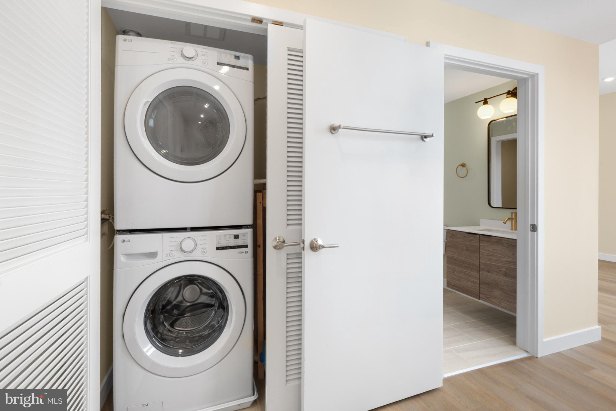 1701 South 4th Street, Unit 407 Philadelphia, PA 19148 - Photo 3 of 31 a view of a hallway with washer and dryer
