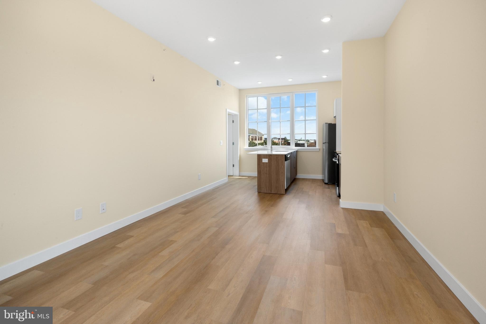 1701 South 4th Street, Unit 407 Philadelphia, PA 19148 - Photo 8 of 31 a view of kitchen with wooden floor