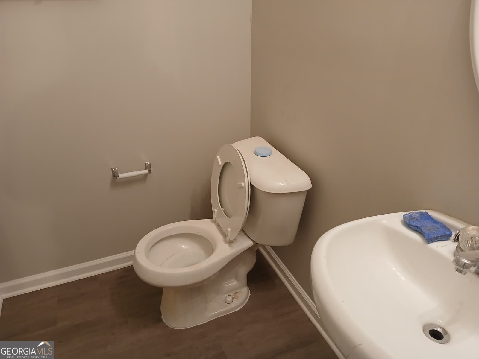 5190 Hanover Street Atlanta, GA 30349 - Photo 15 of 20 a white toilet sitting next to a white sink