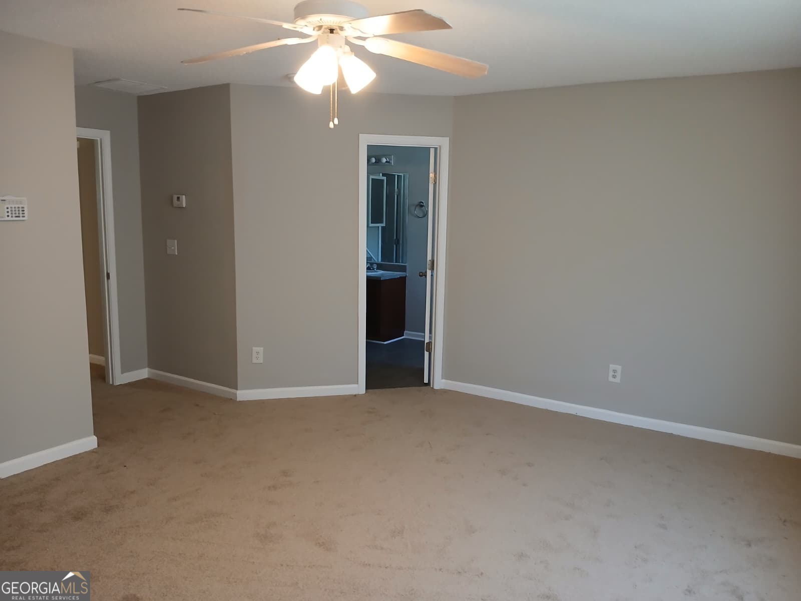 5190 Hanover Street Atlanta, GA 30349 - Photo 2 of 20 a view of an empty room with a chandelier fan