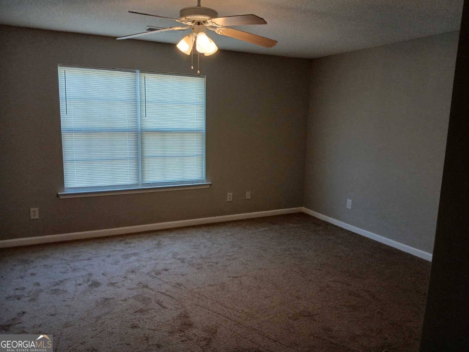 5190 Hanover Street Atlanta, GA 30349 - Photo 6 of 20 an empty room with a window