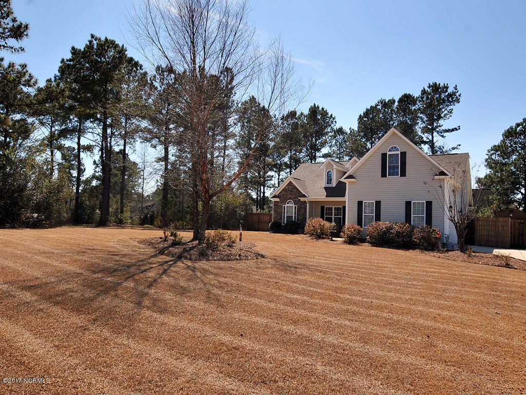 207 Contrail Road Hampstead, NC 28443 - Photo 3 of 21 207 Contrail Dr 4-large yard front view