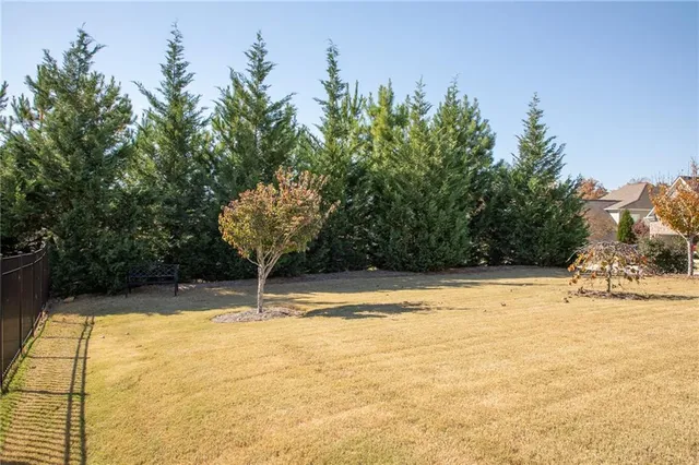a view of a swimming pool with an outdoor space and seating area