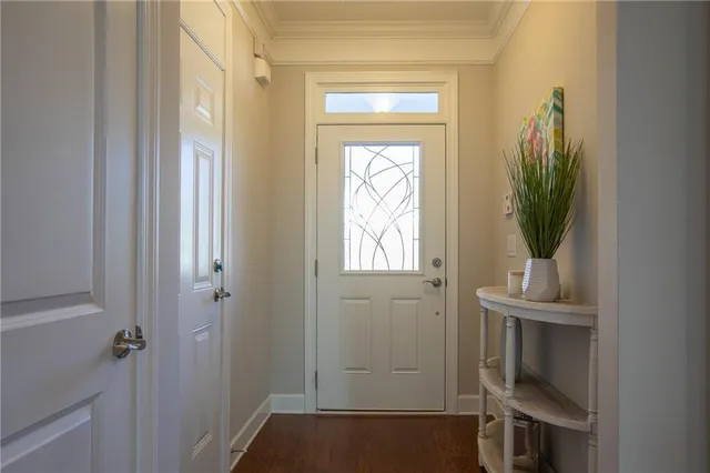 a view of hallway with table and mirror