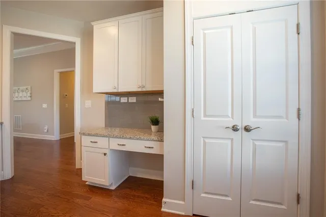 a view of cabinets and wooden floor