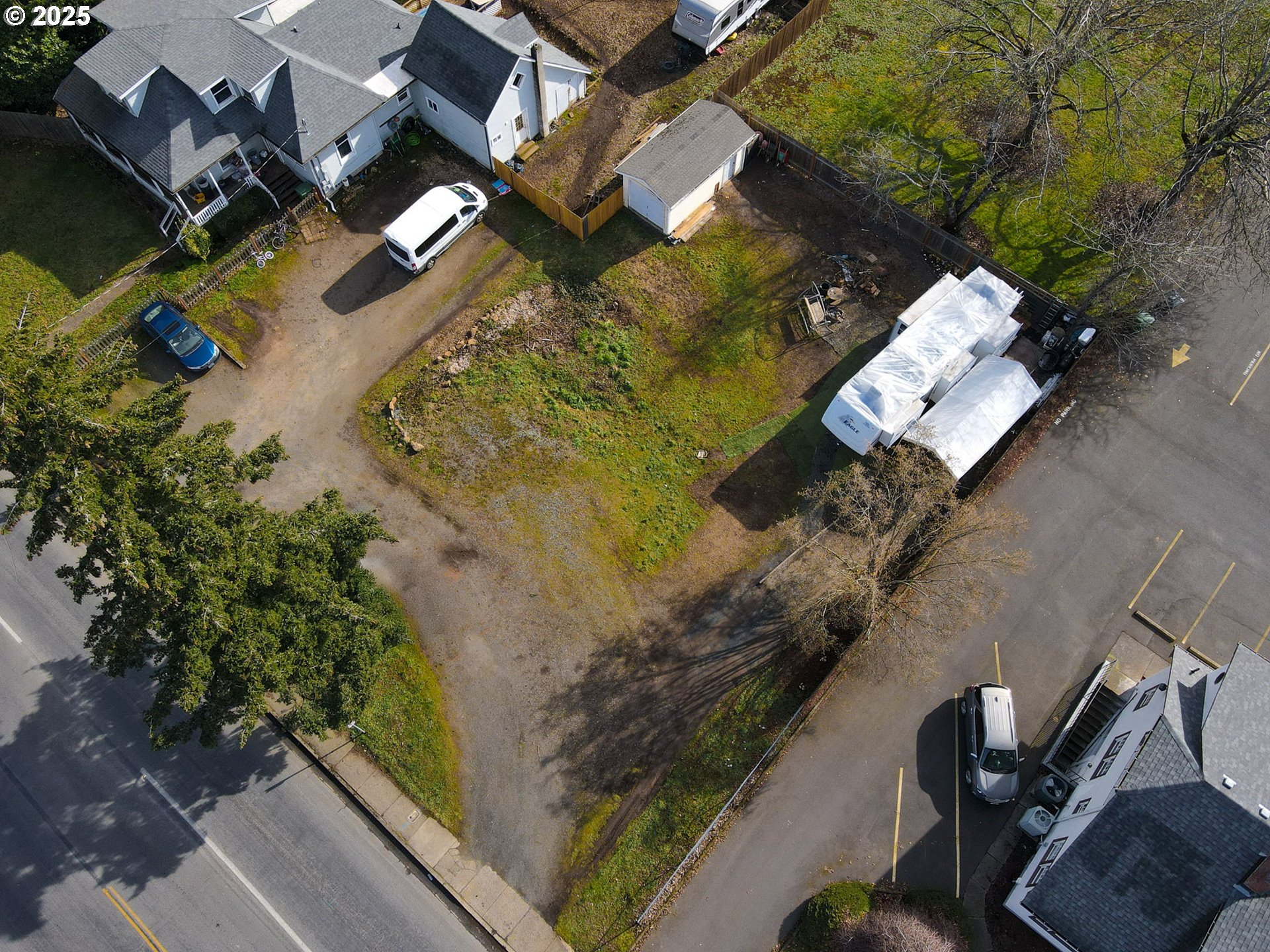 an aerial view of a house with a yard