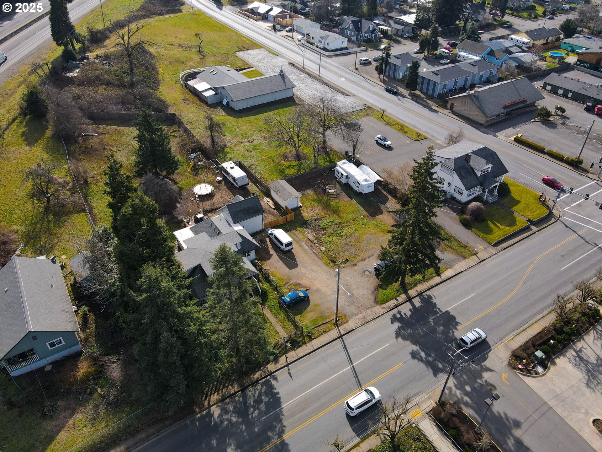 1827 East Main Street Cottage Grove, OR 97424 - Photo 2 of 5 an aerial view of a house yard swimming pool and outdoor seating
