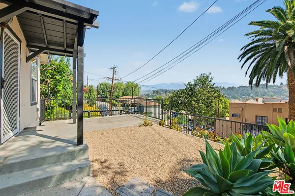 a view of a backyard of the house