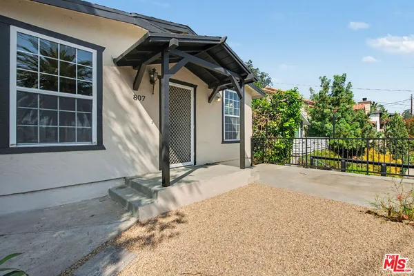 a house with trees in front of it