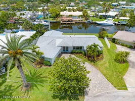 a dining room with furniture a window and wooden floor