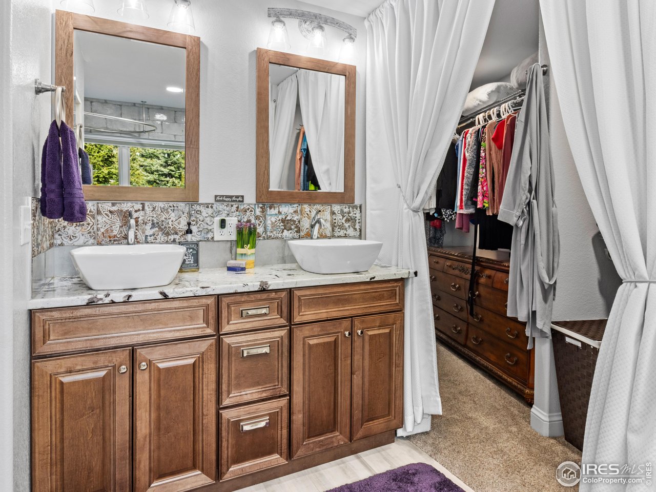 1267 Upper Venner Road Estes Park, CO 80517 - Photo 13 of 44 a bathroom with a double vanity sink and a mirror